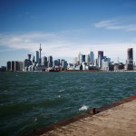 People take photographs of the Toronto skyline and waterfront before Alphabet Inc, the owner of Google, announced the project "Sidewalk Toronto", that will develop an area of Toronto's waterfront using new technologies to develop high-tech urban areas in Toronto, Ontario, Canada October 17, 2017. REUTERS/Mark Blinch