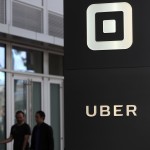 (FILES) This file photo taken on August 25, 2016 shows the logo of the ride sharing service Uber in front of its headquarters in San Francisco, California. Waymo, the self-driving car unit of Google parent Alphabet, has reached an agreement with ridesharer Lyft to test self-driving car technology, the companies said. Waymo and Lyft are joining forces against ridesharing giant Uber, which is racing to develop its own self-driving vehicles."We're looking forward to working with Lyft to explore new self-driving products that will make our roads safer and transportation more accessible," a Waymo spokesman told AFP. / AFP PHOTO / GETTY IMAGES NORTH AMERICA / JUSTIN SULLIVAN