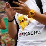 Participants take part in the world's first "Pokemon Go" competition in Hong Kong, China, August 6, 2016. REUTERS/Tyrone Siu