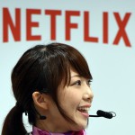 A sales clerk explains how to use Netflix during the kick-off event of the Netflix business in Japan at a Softbank shop in Tokyo on September 2, 2015. With a partnership with Japanese major mobile phone operator SoftBank, Netflix hopes to tap an estimated 36 millions of Japanese households which have access to high speed broadband internet communication. AFP PHOTO / TOSHIFUMI KITAMURA