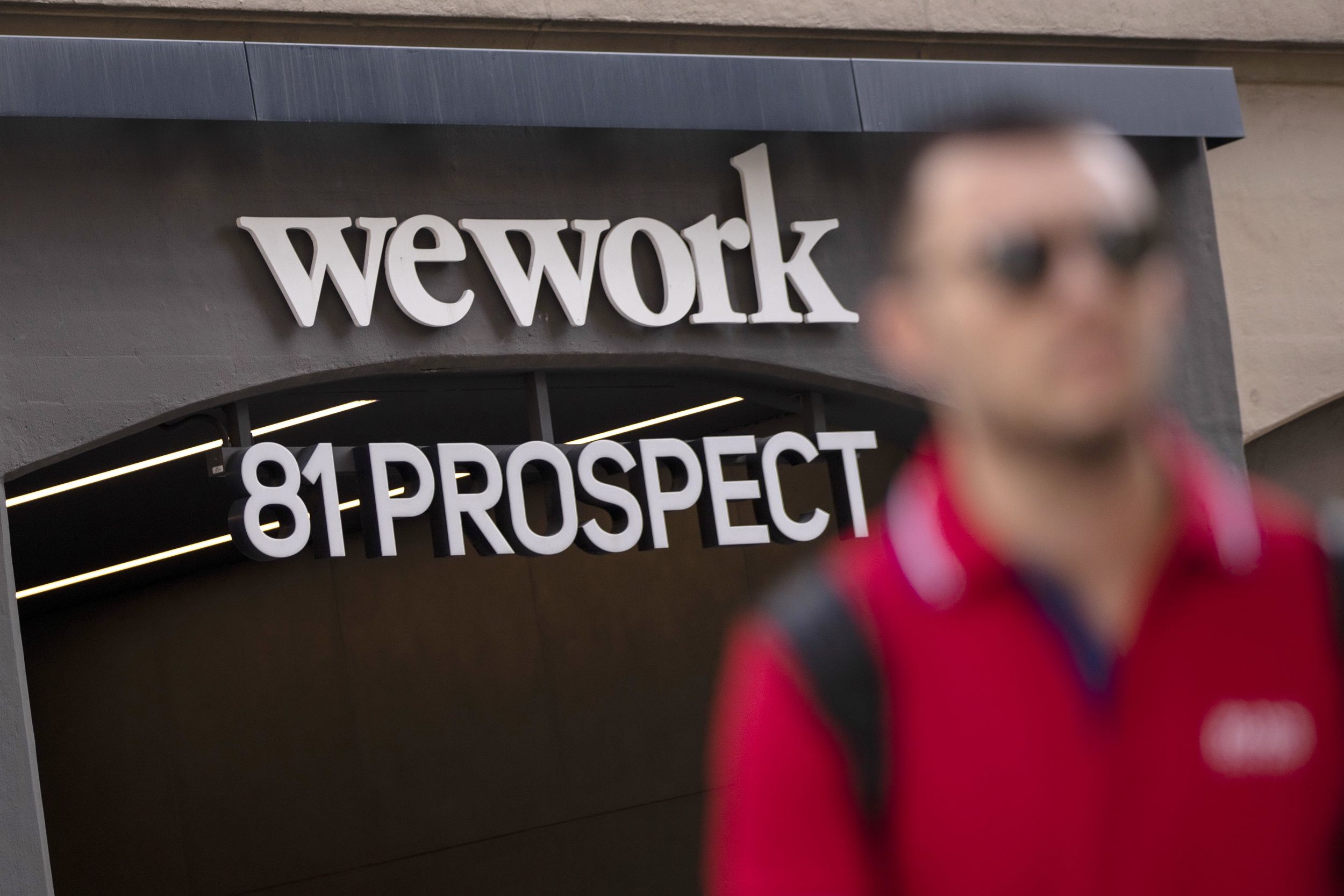 WeWork估值銳降，IPO集資被迫暫緩。（法新社資料圖片）