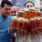 Struempfl competes to set a new world record in carrying one liter beer mugs in Abensberg