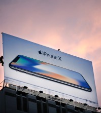 Workers finish putting up a new iPhone X billboard above Union Square in advance of the iPhone X launch on November 3, 2017, in San Francisco, California.
Apple's flagship iPhone X hits stores around the world as the company predicts bumper sales despite the handset's eye-watering price tag, and celebrates a surge in profits. / AFP PHOTO / Elijah Nouvelage