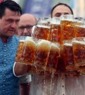 Struempfl competes to set a new world record in carrying one liter beer mugs in Abensberg